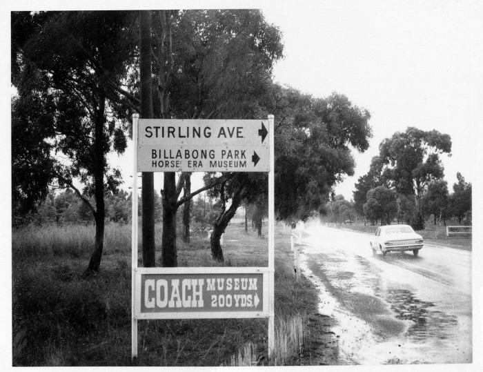 A new, and fairly large, blue and white sign reading Coach Museum 100 yards A new, and fairly large, blue and white sign reading Coach Museum 100 yards
